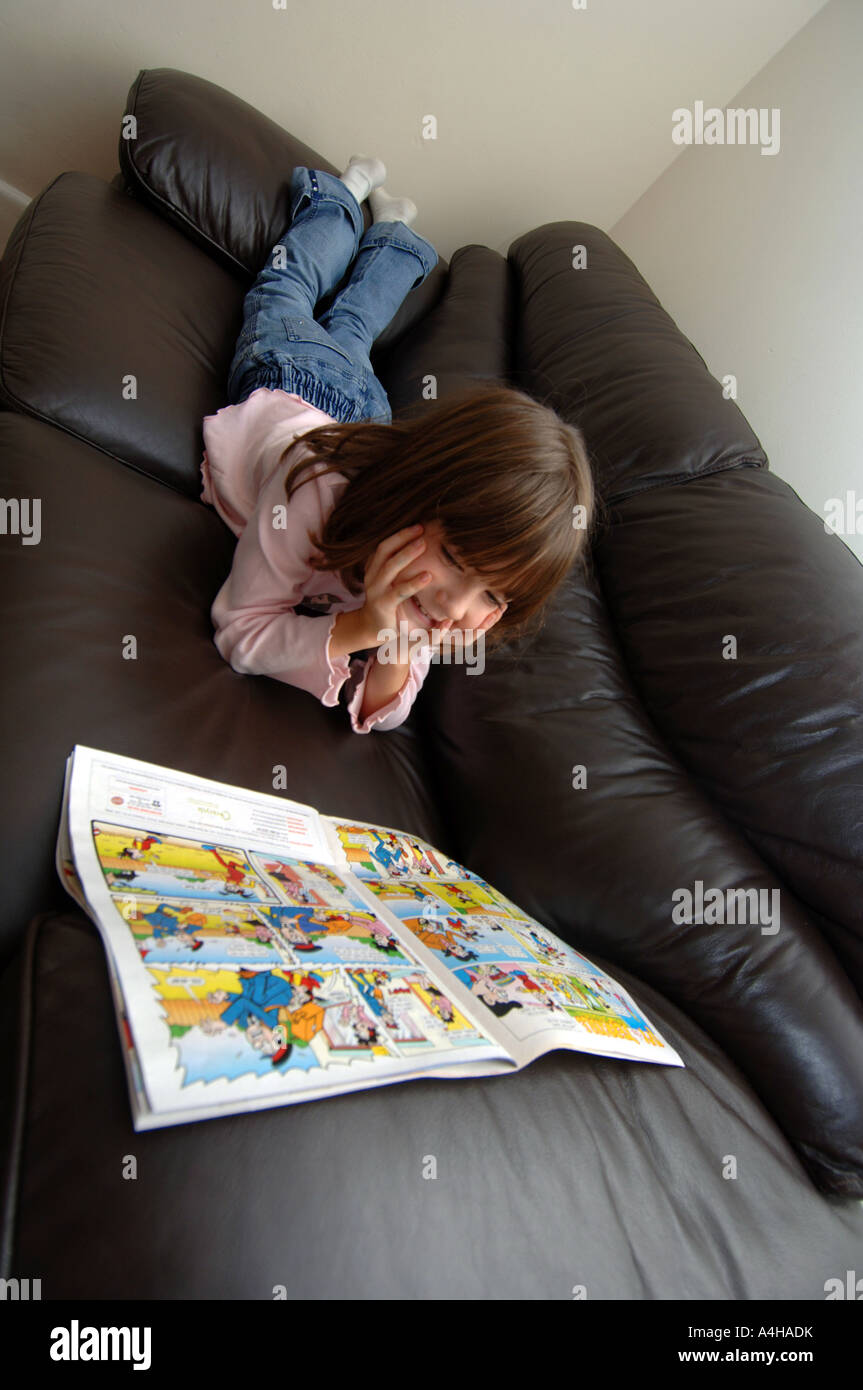 Comic, girl reading comic, comics Stock Photo