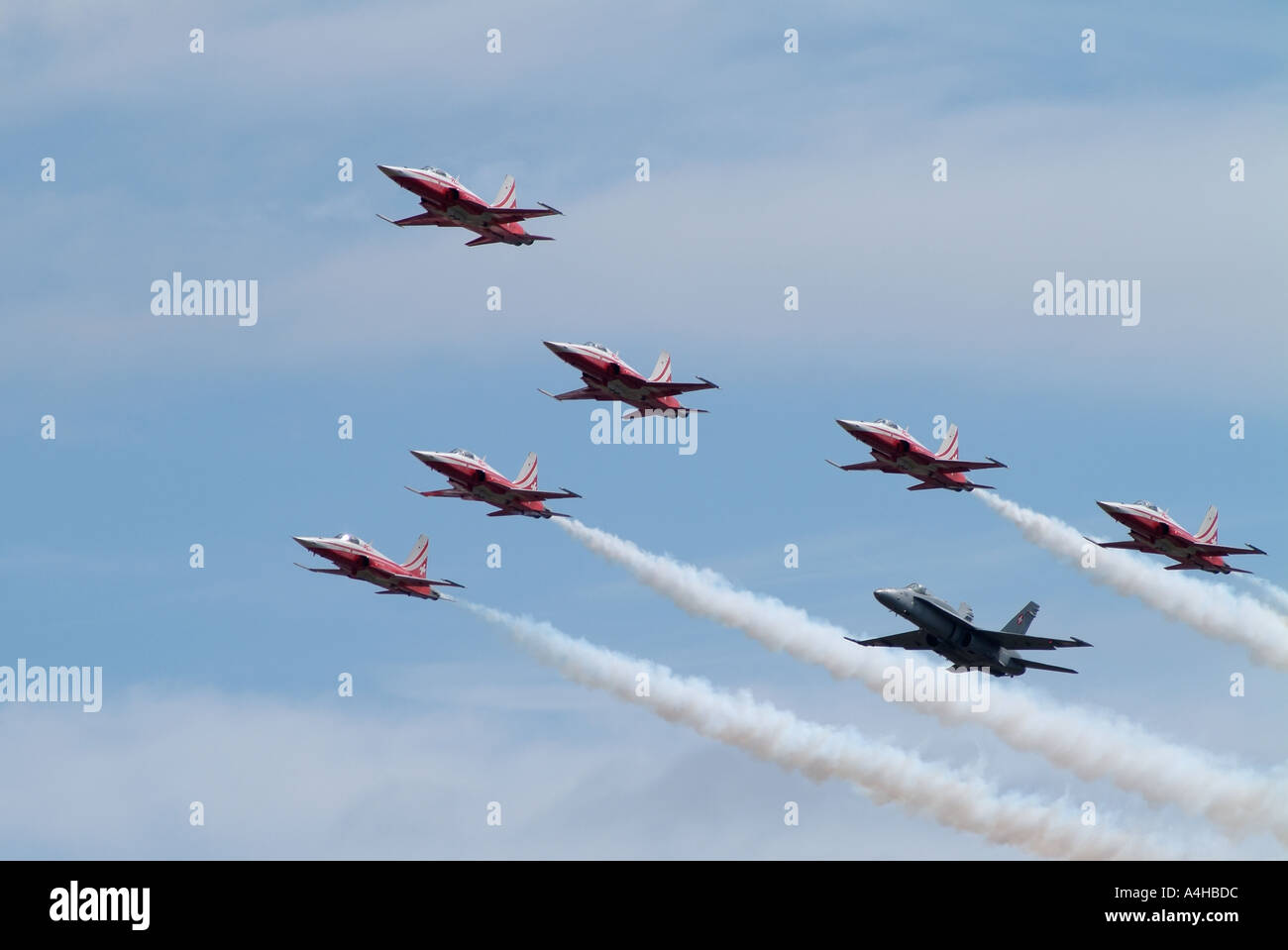 Swiss Airforce Aerobatic Display Team in formation with a F A 18C Hornet Stock Photo