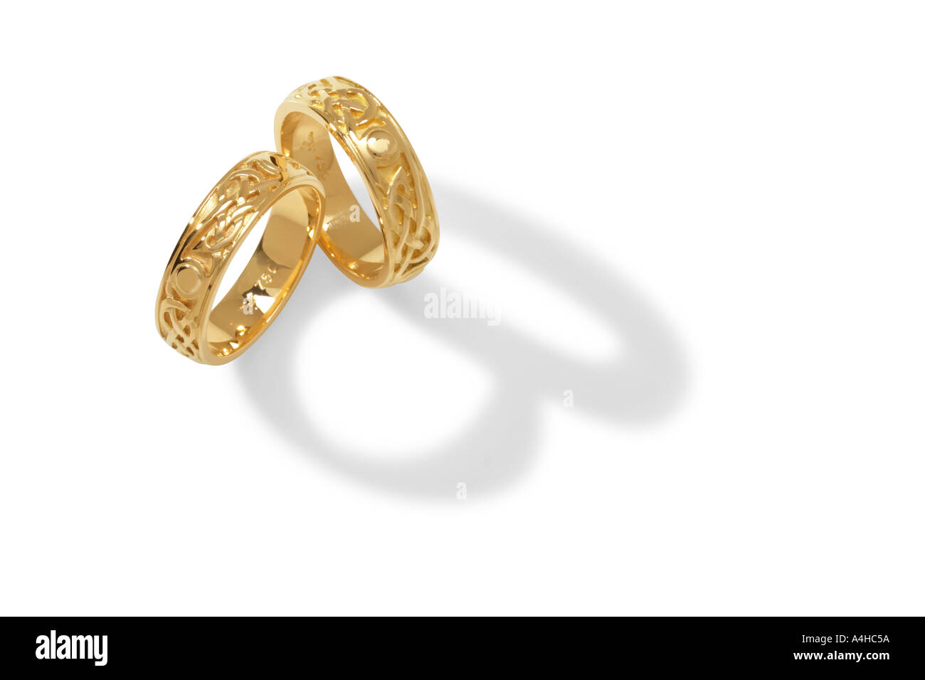Celtic gold wedding rings Stock Photo