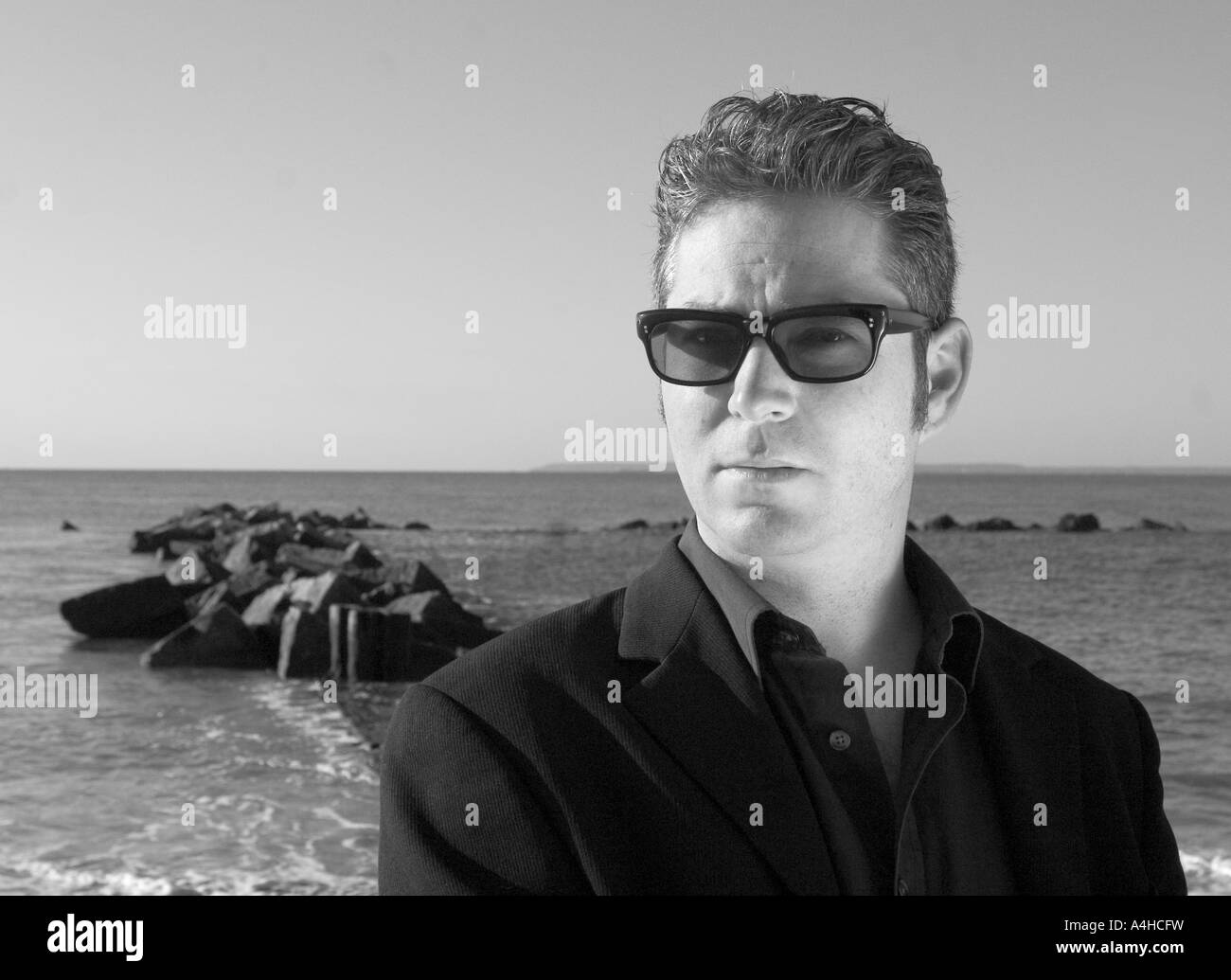 man in sunglasses on beach Stock Photo