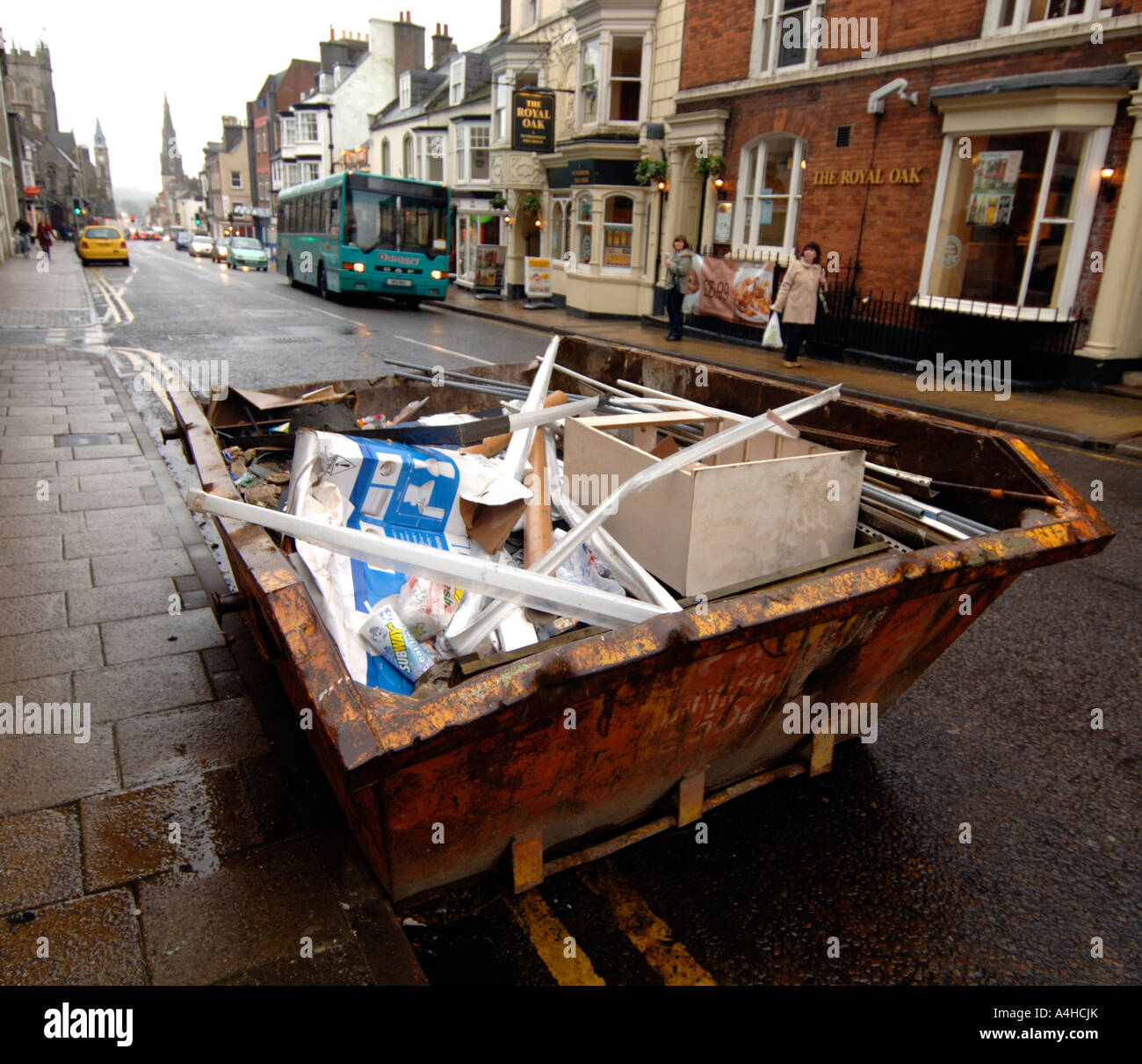 Skip, rubbish skip on residential street, Britain, UK Stock Photo Alamy