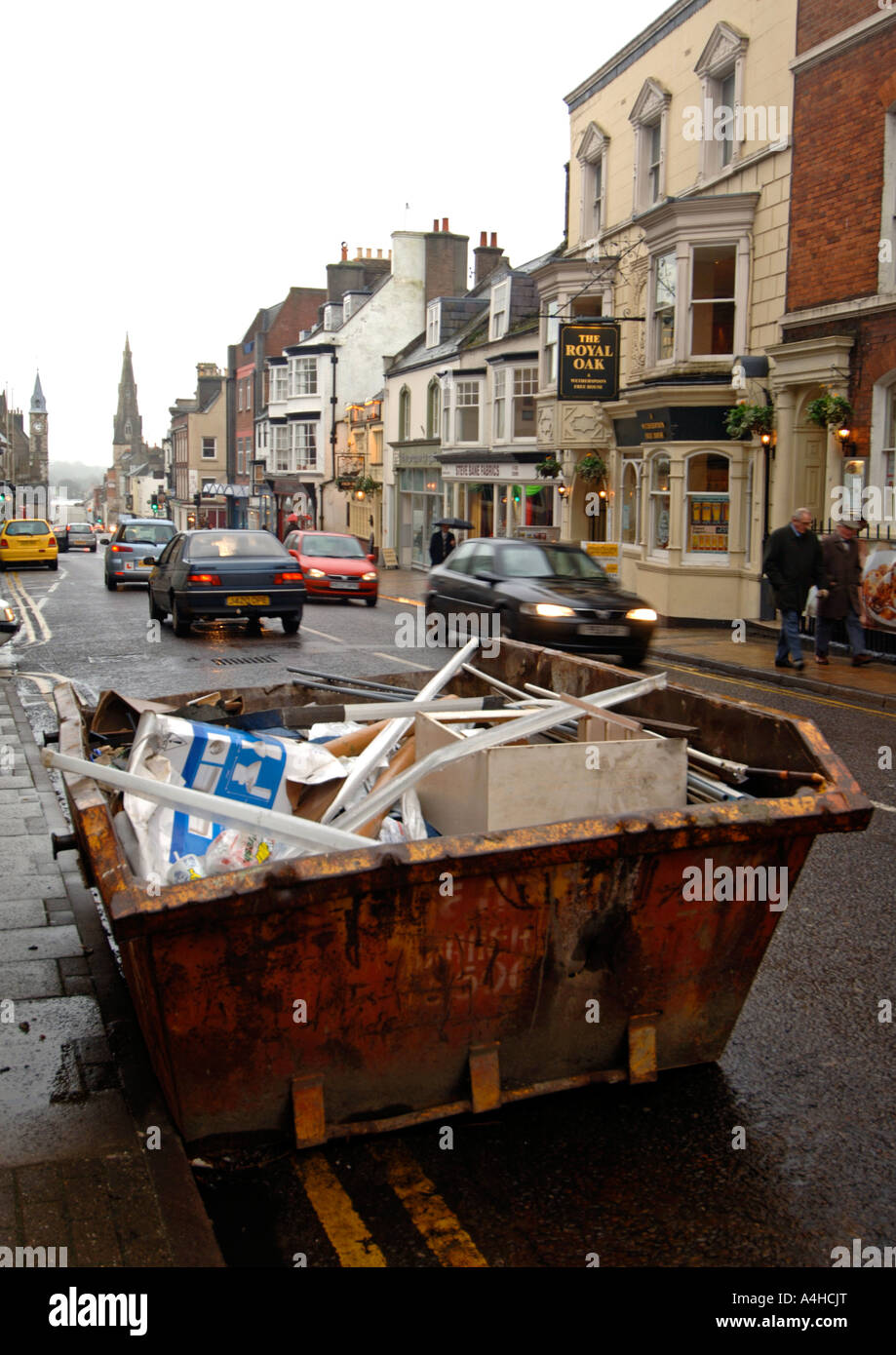 Skip, rubbish skip on residential street, Britain, UK Stock Photo Alamy