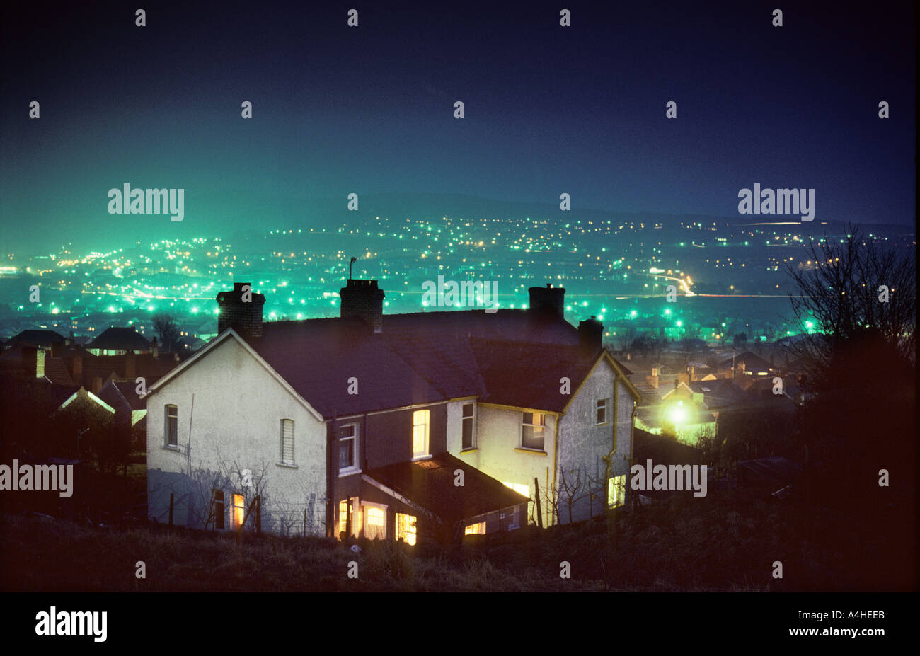 House at Ebbw Vale at night with light pollution from street lights in