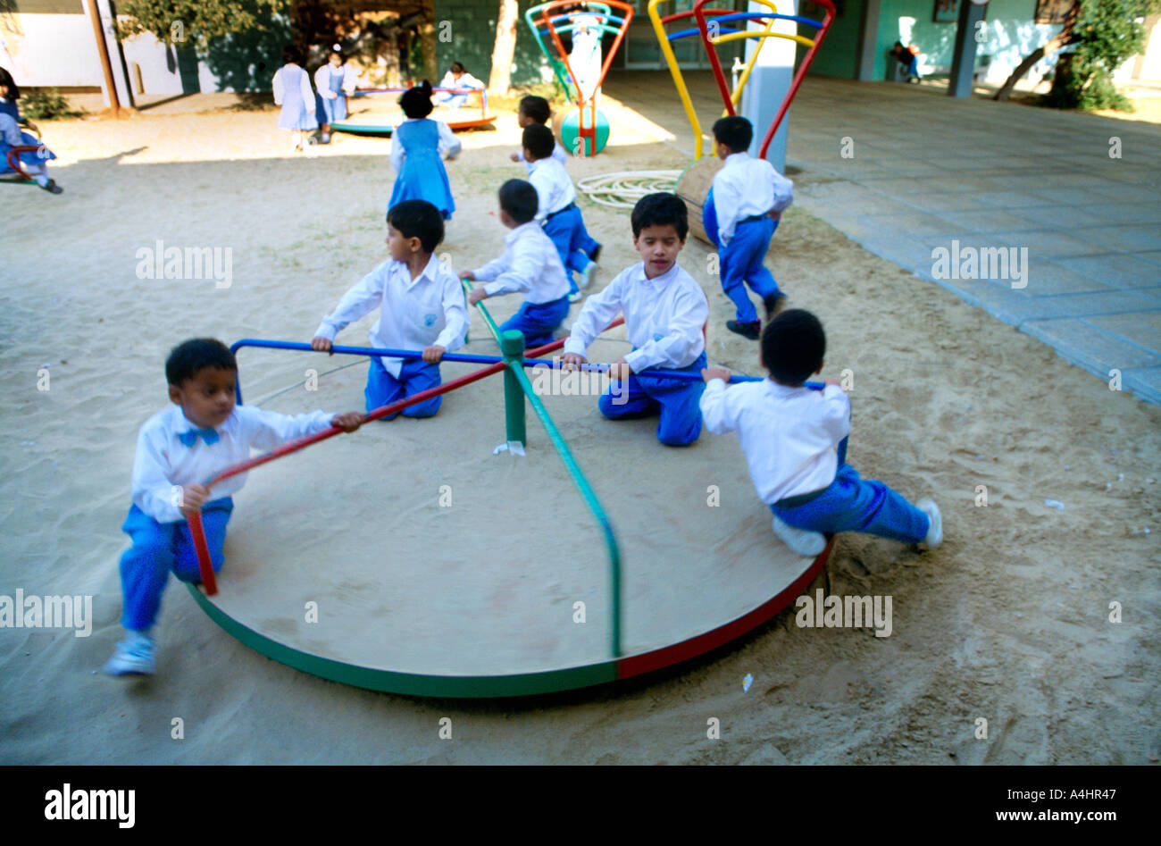 Abu Dhabi UAE Kindergarten Children On Roundabout Stock Photo - Alamy