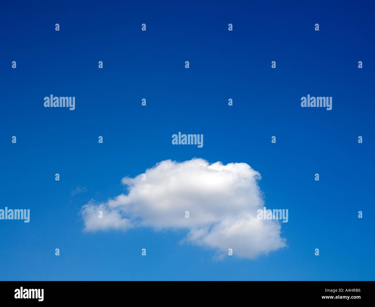 Single Cloud in Blue Sky Stock Photo
