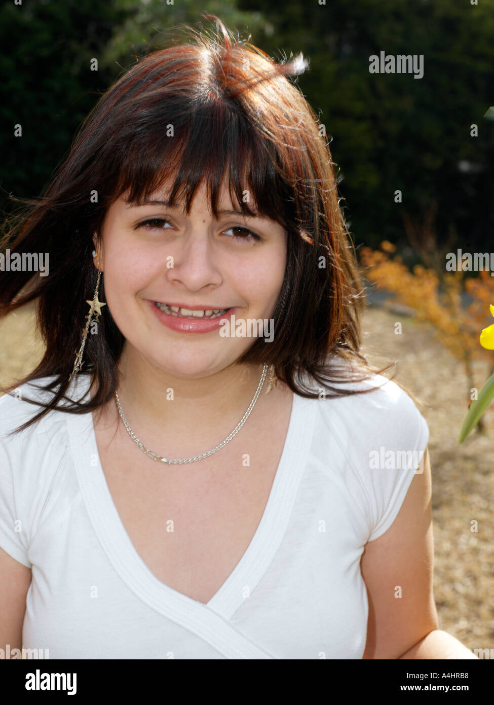 Thirteen Year Old Teenage Girl with Red Highlights in Hair Stock Photo