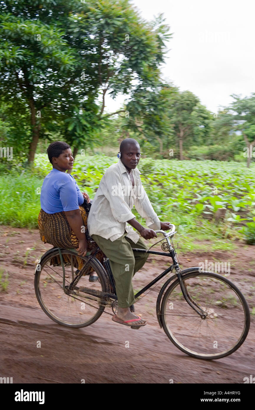 man-and-woman-on-a-bicycle-in-the-village-of-mambala-malawi-africa-A4HRYG.jpg