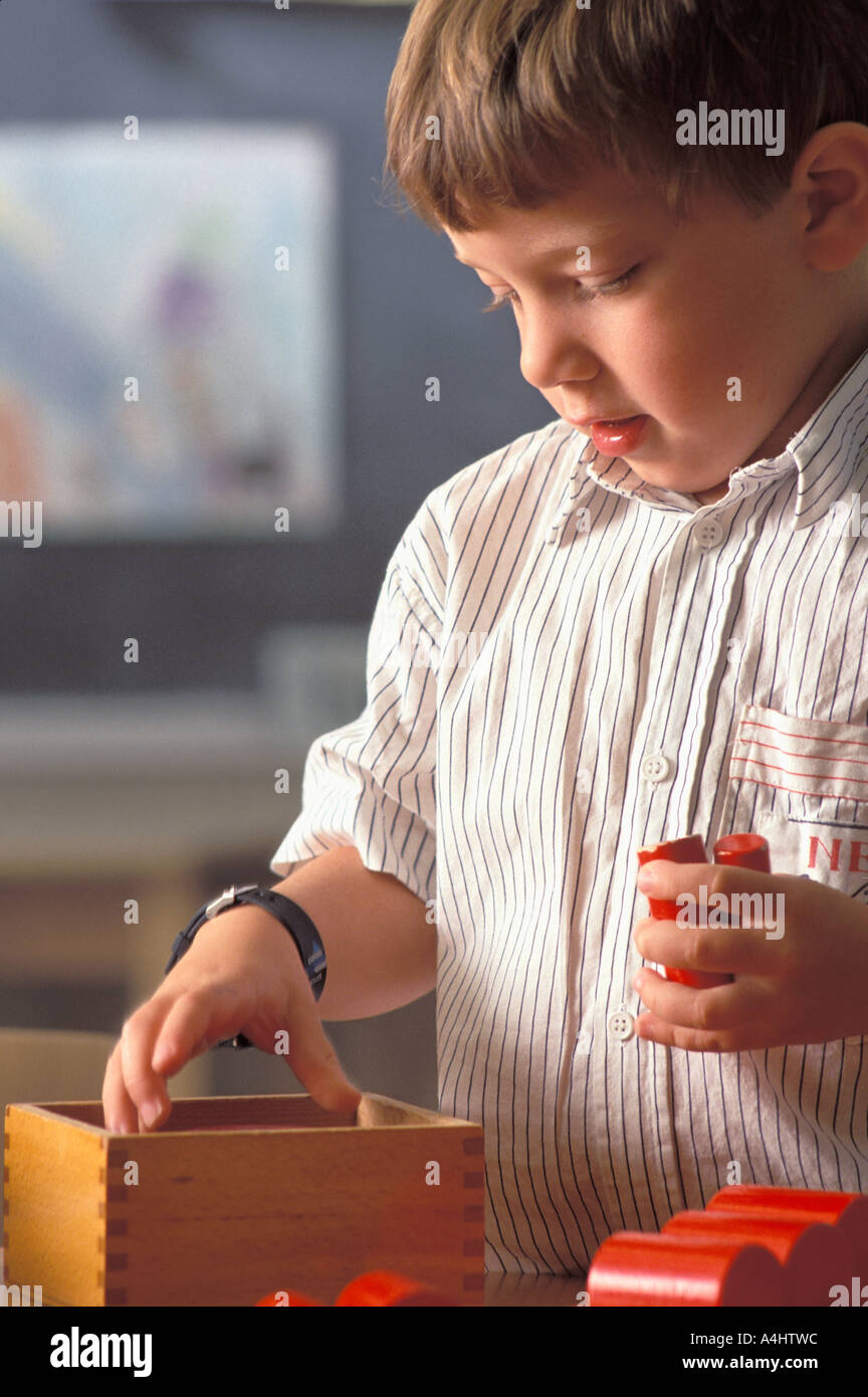 Preschool boy playing with blocks Stock Photo - Alamy