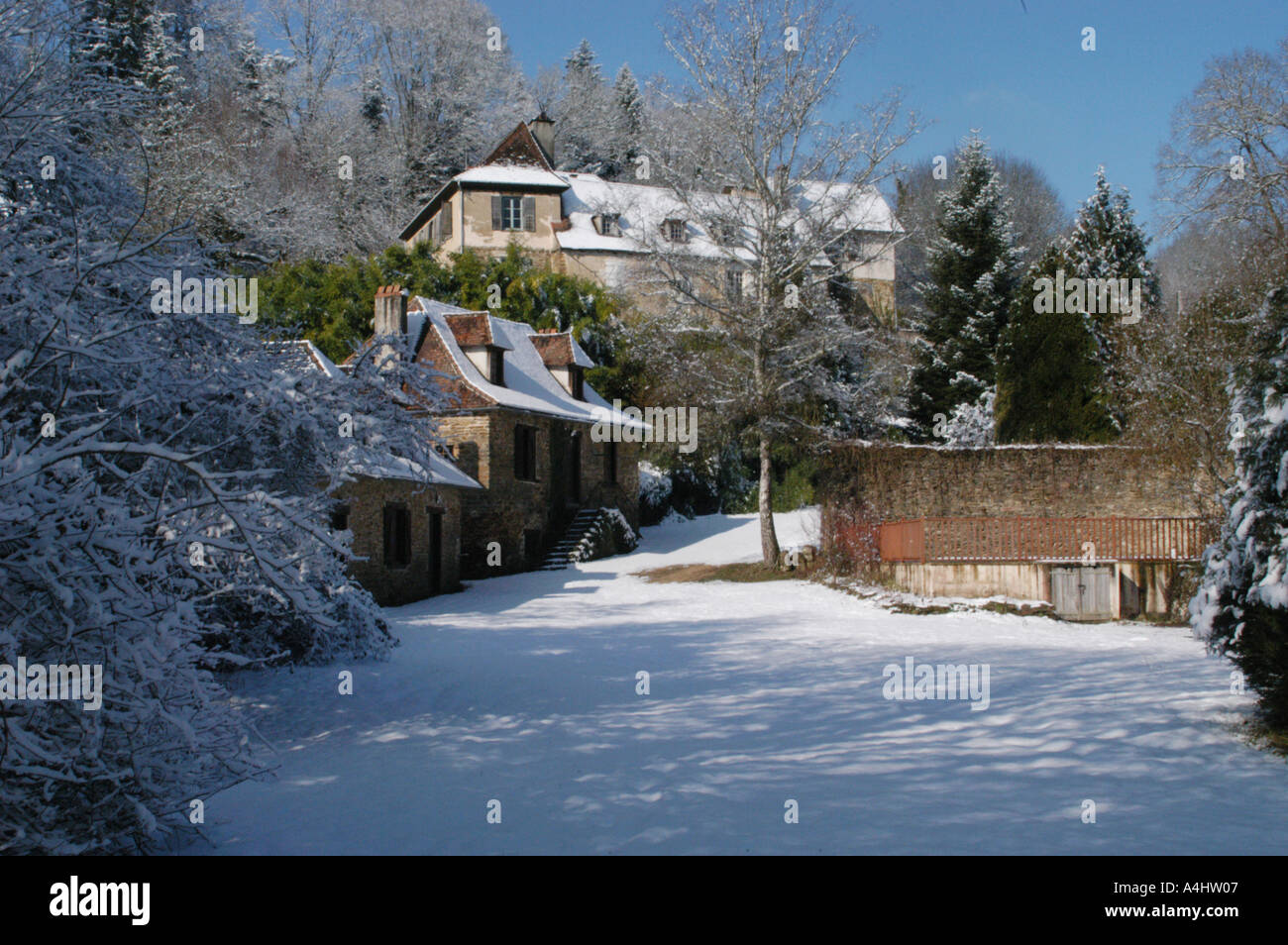 holiday gites winter scene with snow and trees in france Stock Photo