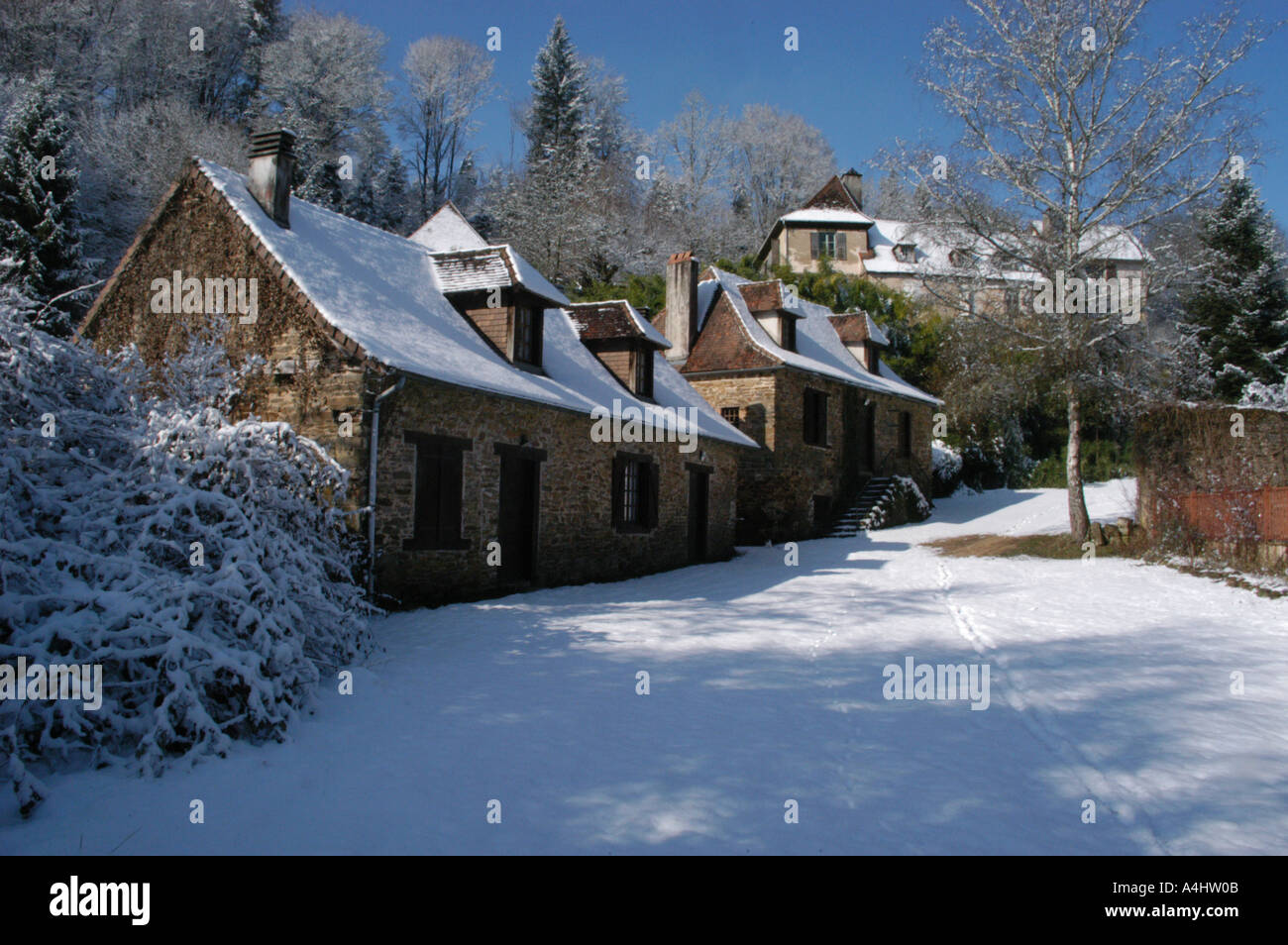 french winter holiday gites in the snow with trees Stock Photo