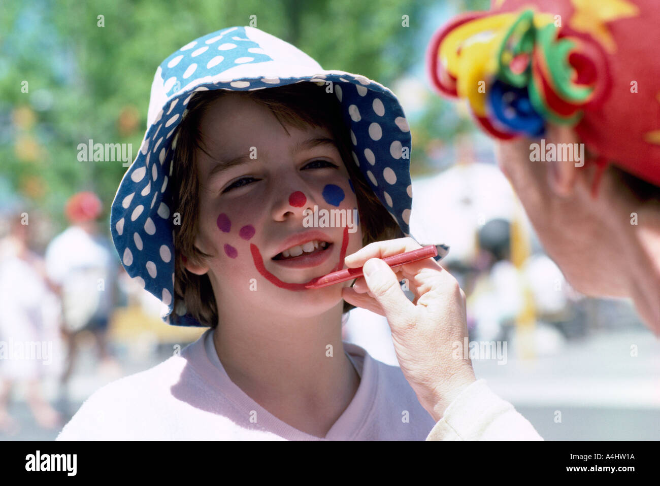 Painting the Face of a Young Person in British Columbia Canada Stock Photo