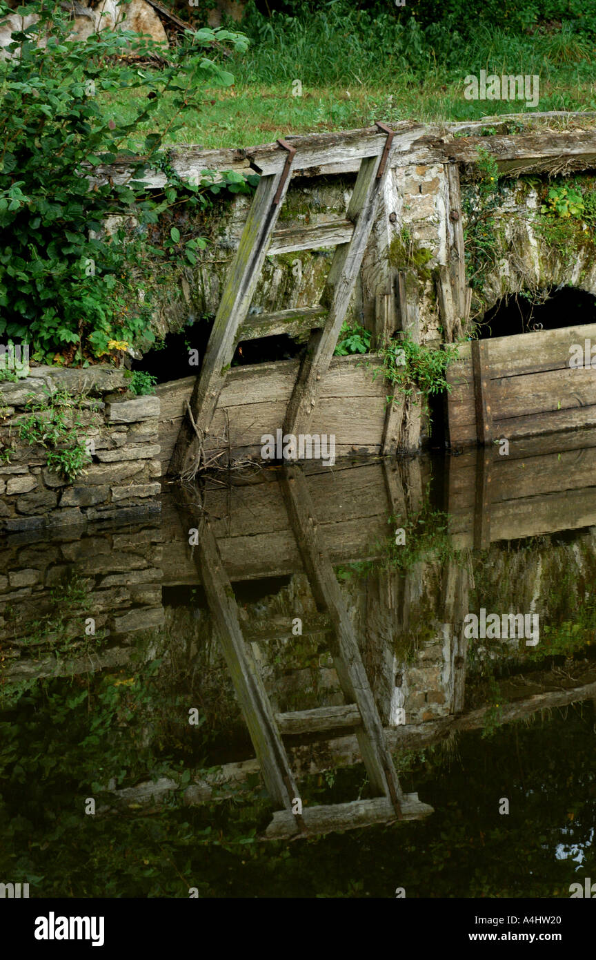 wooden lock gates to control water from a lake in france Stock Photo Alamy