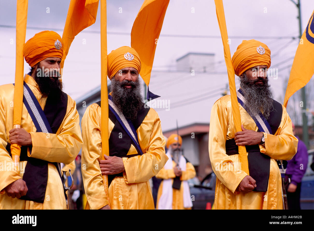 Vaisakhi Festival, Vancouver, BC, British Columbia, Canada Sikh Men marching with Banners in
