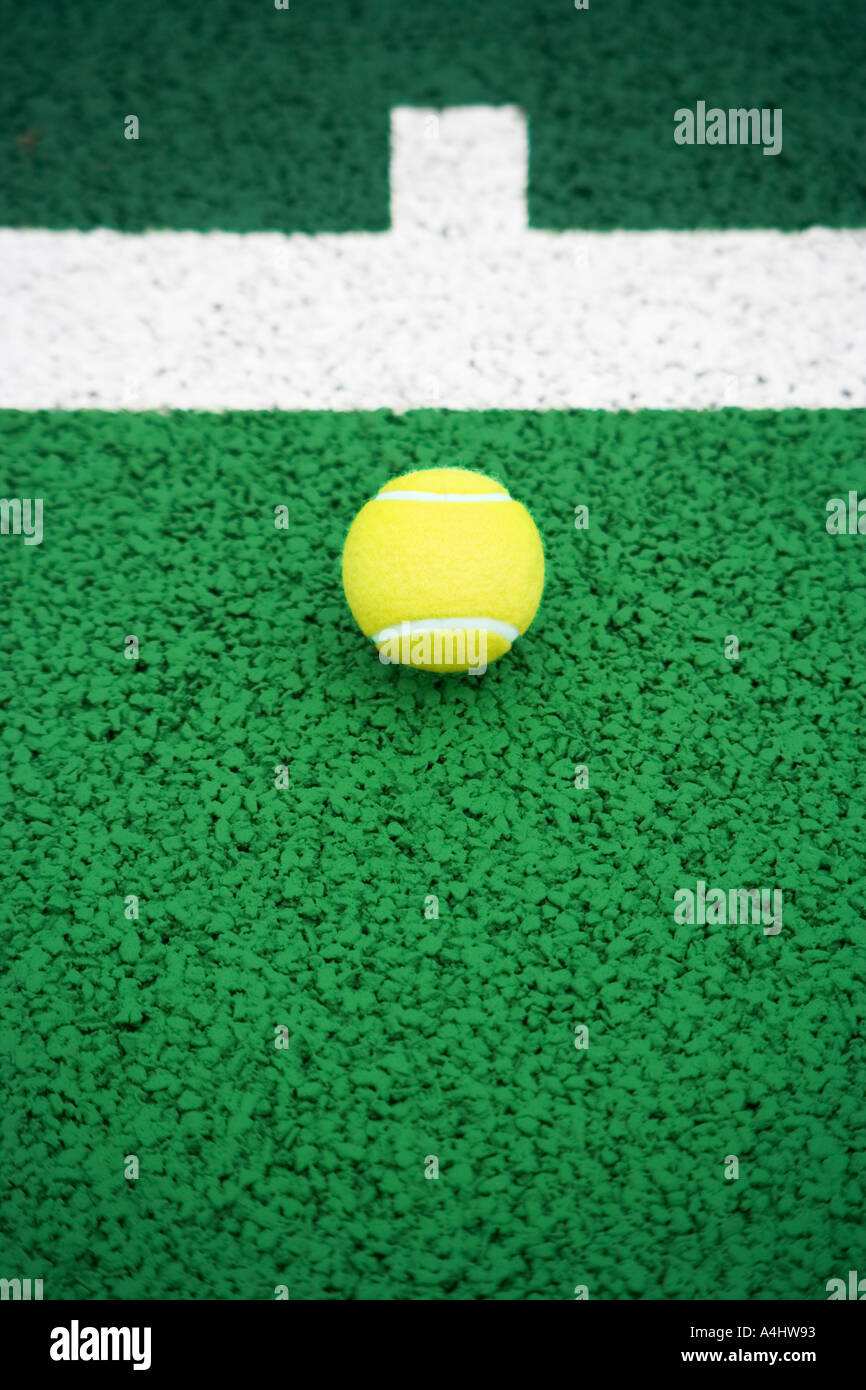 Tennis ball on tennis court Stock Photo