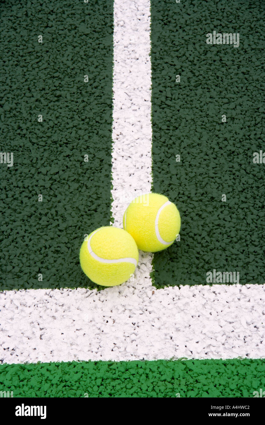 Two tennis balls on lawn tennis court Stock Photo Alamy