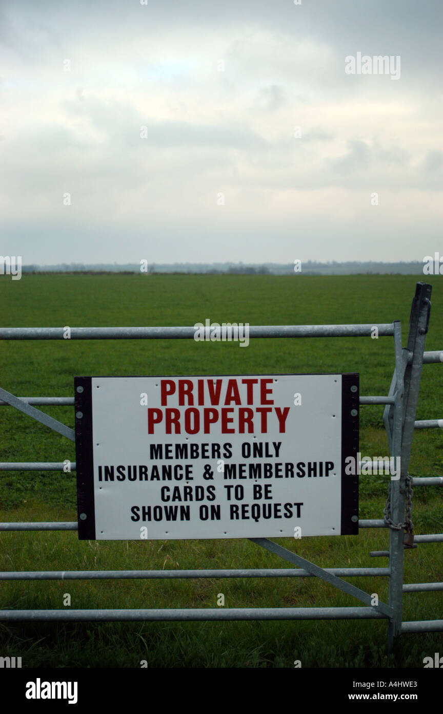 gate with private property and insurance and membership ID card sign Stock Photo
