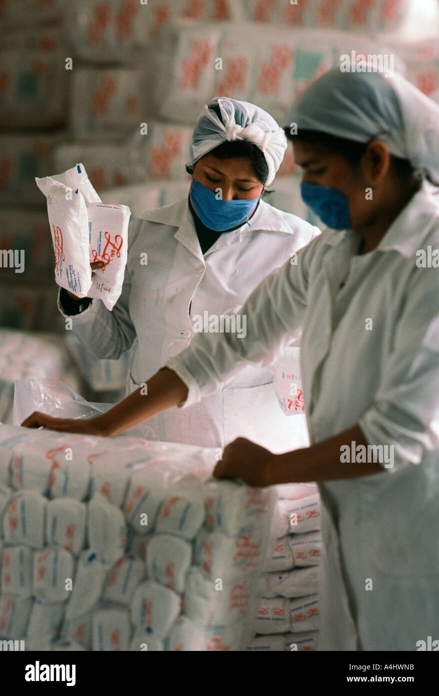 Mexican warehouse workers packaging sugar Stock Photo