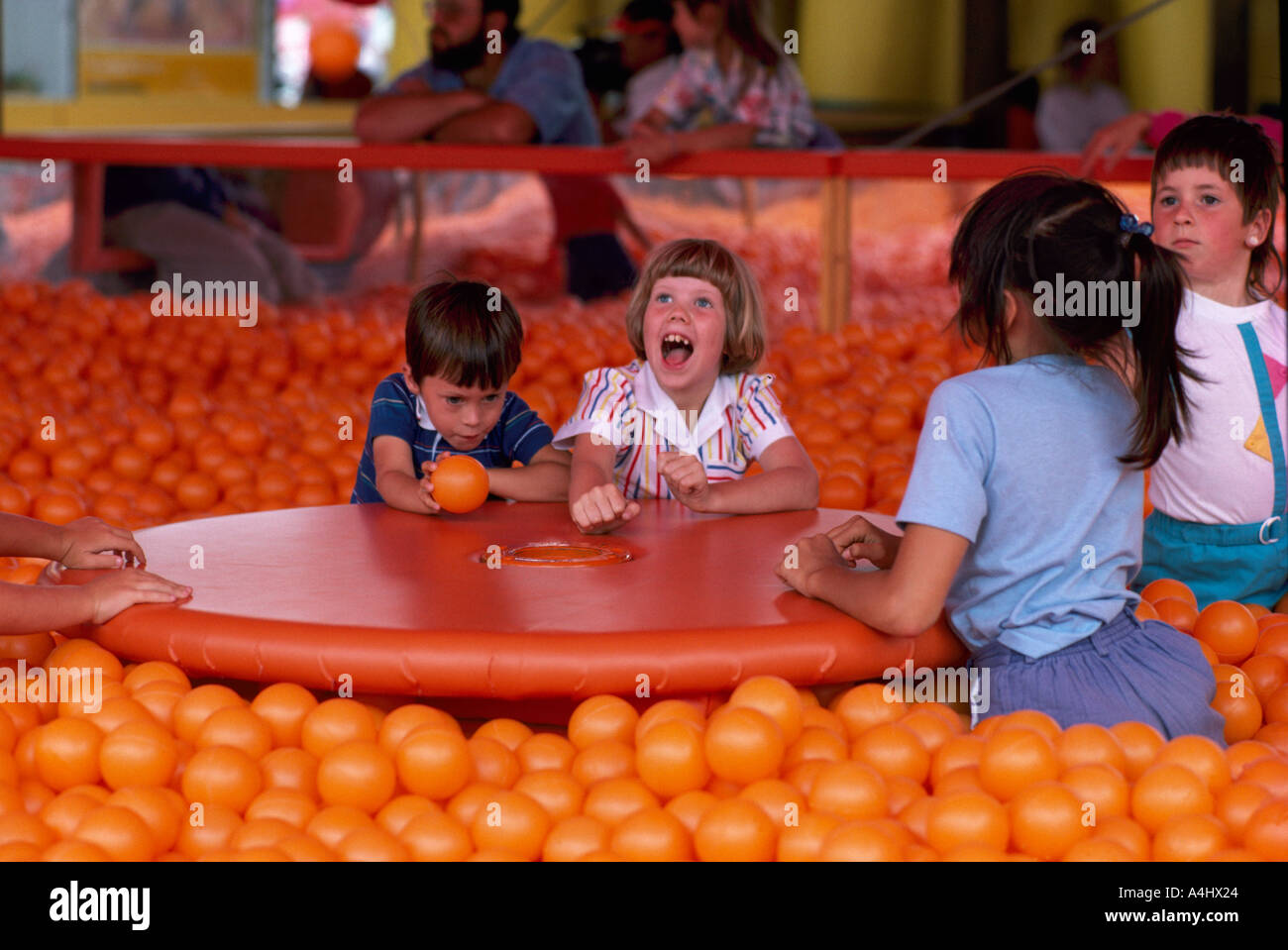 Young Children play in a Room filled with Balls in British Columbia Canada Stock Photo