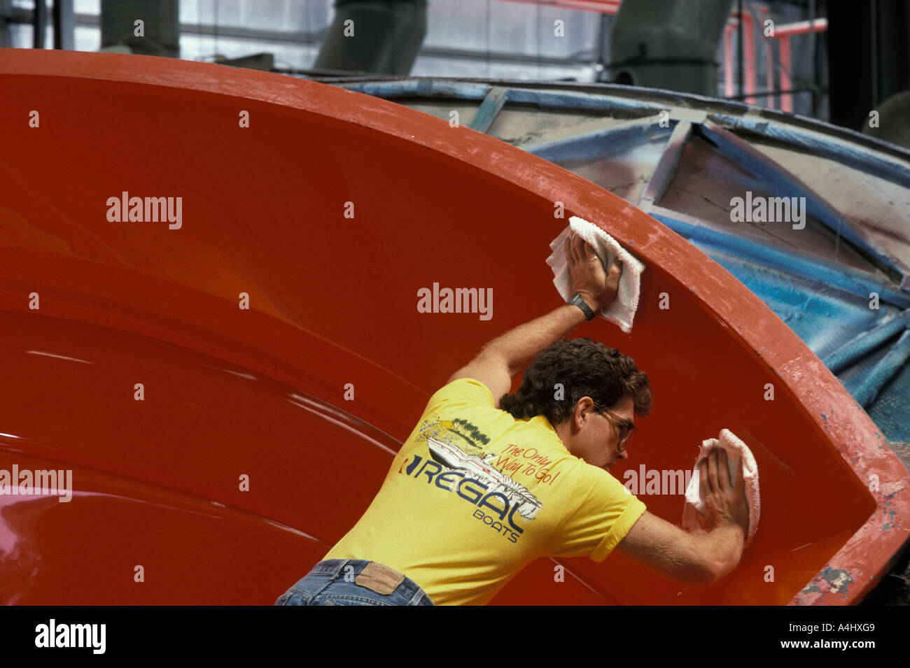 cleaning fiberglass gelcoat as boat removed from mold Stock Photo Alamy