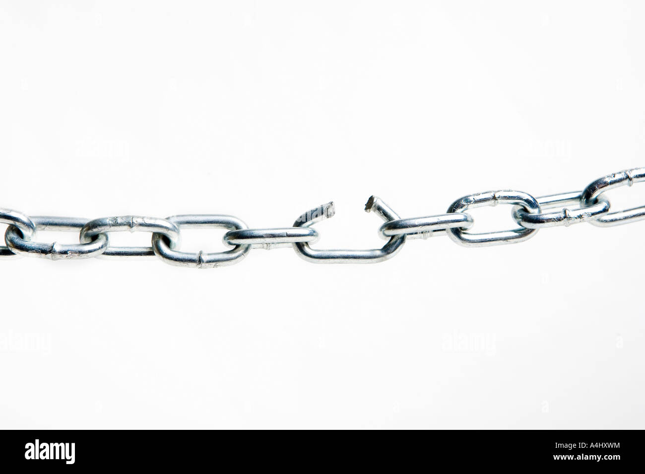 Broken link in a silver chain Stock Photo Alamy
