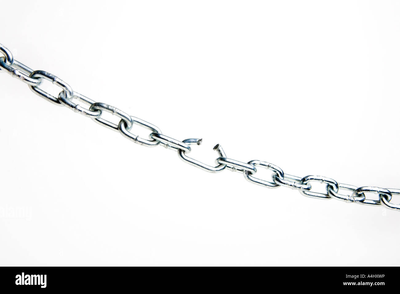 Broken link in a silver chain Stock Photo