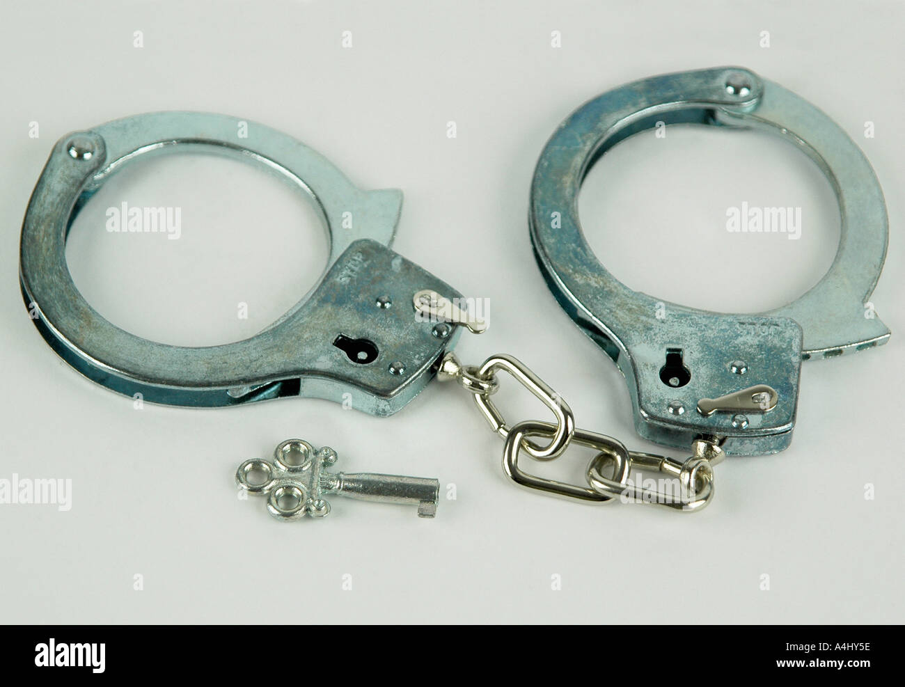 Handcuffs with key Stock Photo Alamy