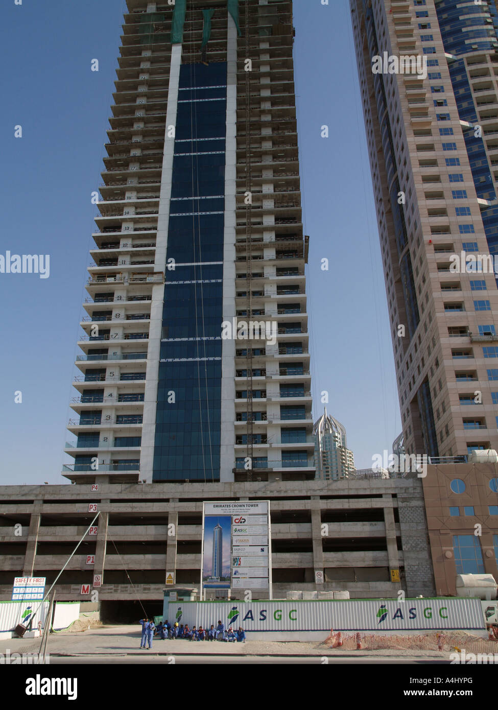 Dubai Marina workers at construction site to Emirates Crown Tower Stock