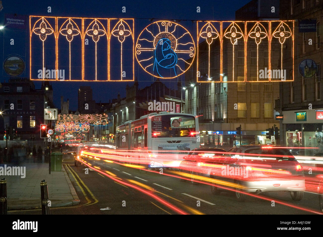City centre roads, traffic trails, businesses and Christmas lights decorations in Aberdeen, Scotland, UK Stock Photo