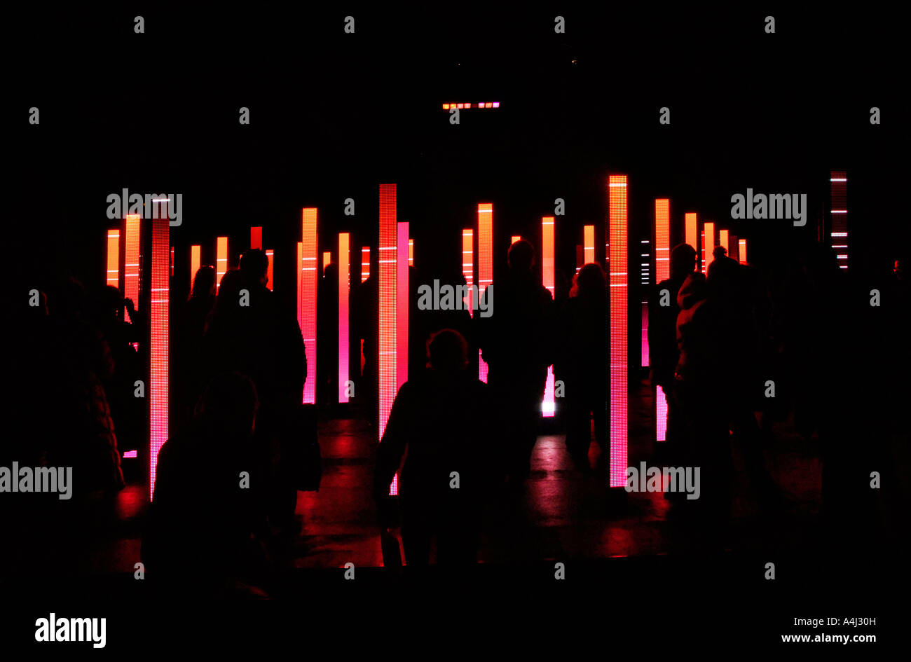 Visitors admiring the light and sound installation "Volume" at the V&A Garden in London Stock Photo