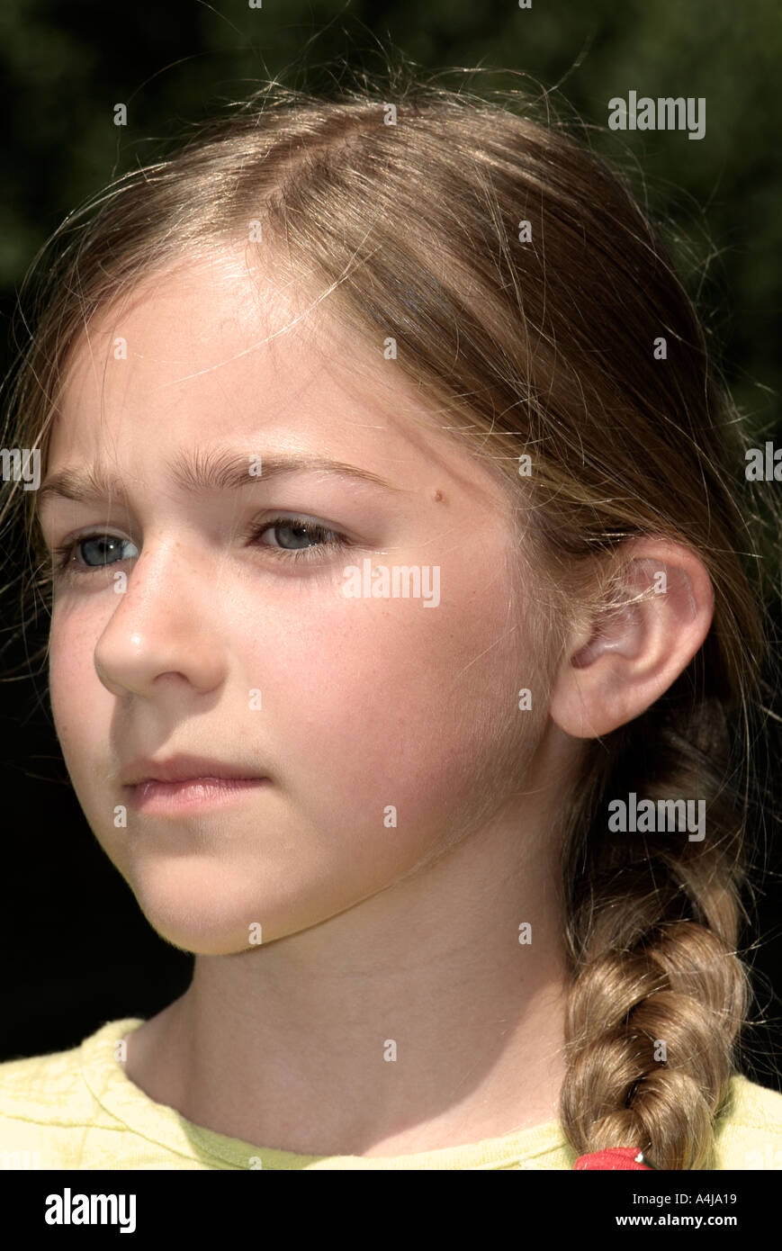 Portrait of a young blond girl with blue eyes smiling Stock Photo - Alamy