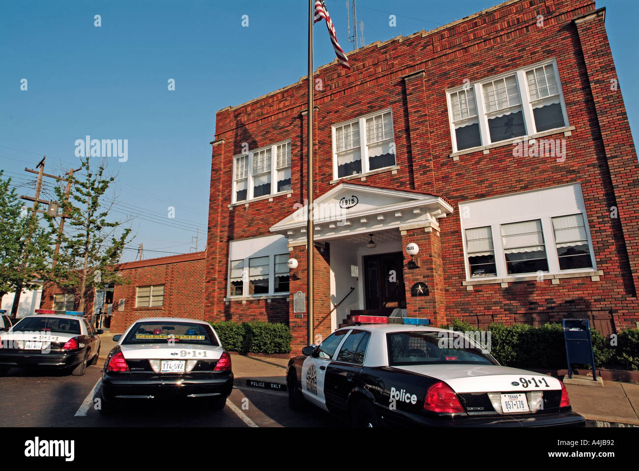 Police cars parked in front of the police station of Ennis Texas Stock