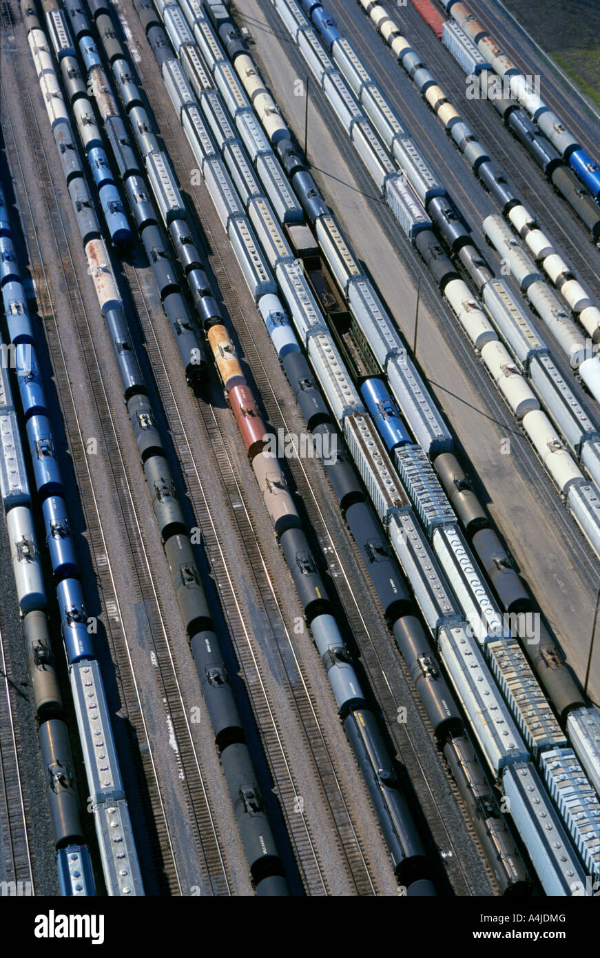 Tank cars and hopper cars mostly for transporting chemicals standing by in a Southern Illinois yard awaiting makeup into trains. Stock Photo