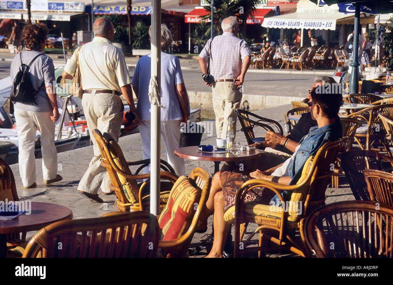 People relaxing in a harbourside café bar in Rovinj Stock Photo - Alamy
