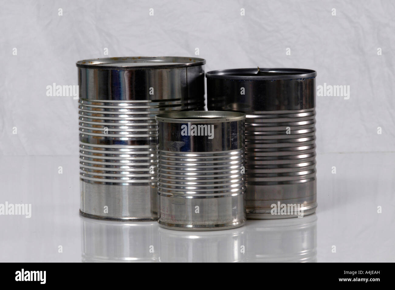 Three Tin Cans Differing Sizes Stock Photo Alamy