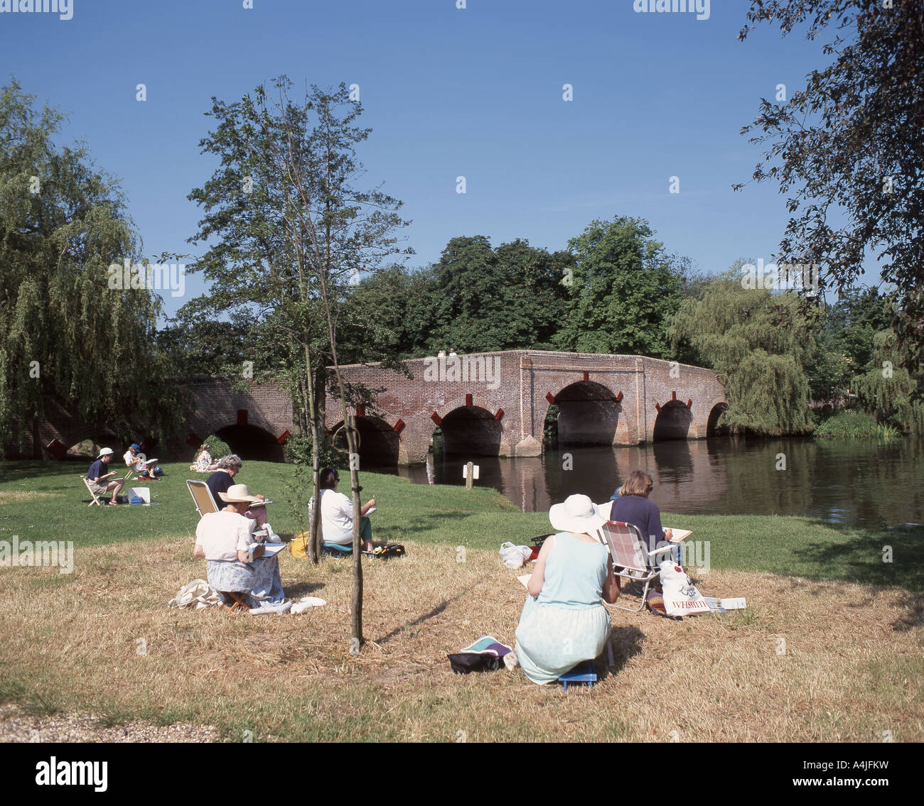 Amateur artists drawing riverbank scene by River Thames, Sonning, Berkshire, England, United Kingdom Stock Photo