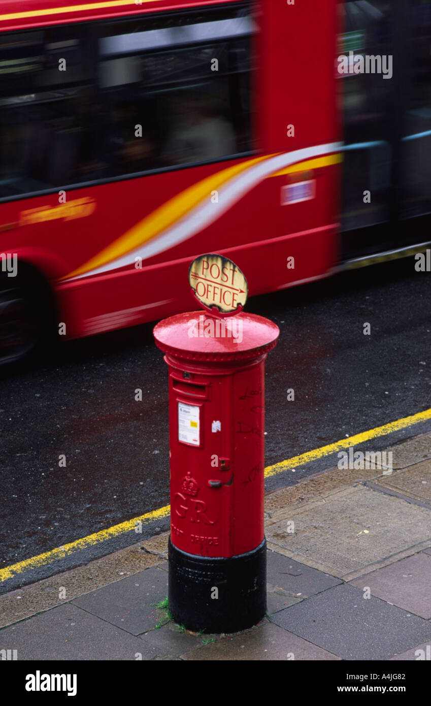 King George postbox and modern bus in Ealing London England UK 2004 Stock Photo