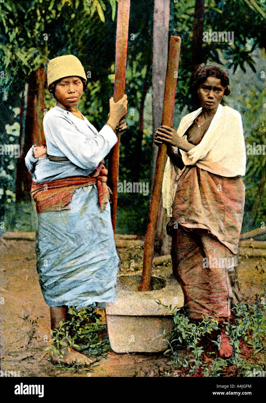 Women pounding rice, Madagascar,  late 19th century. Artist: Unknown Stock Photo