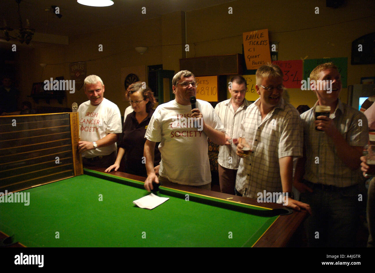 Punters watch live mouse racing in a pub in Tralee, County Kerry, Ireland Stock Photo