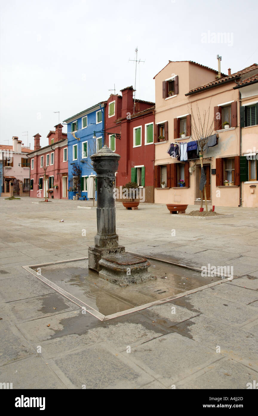 typical drinking water fountain piazza square burano island with background venice venezia veneto italy Stock Photo