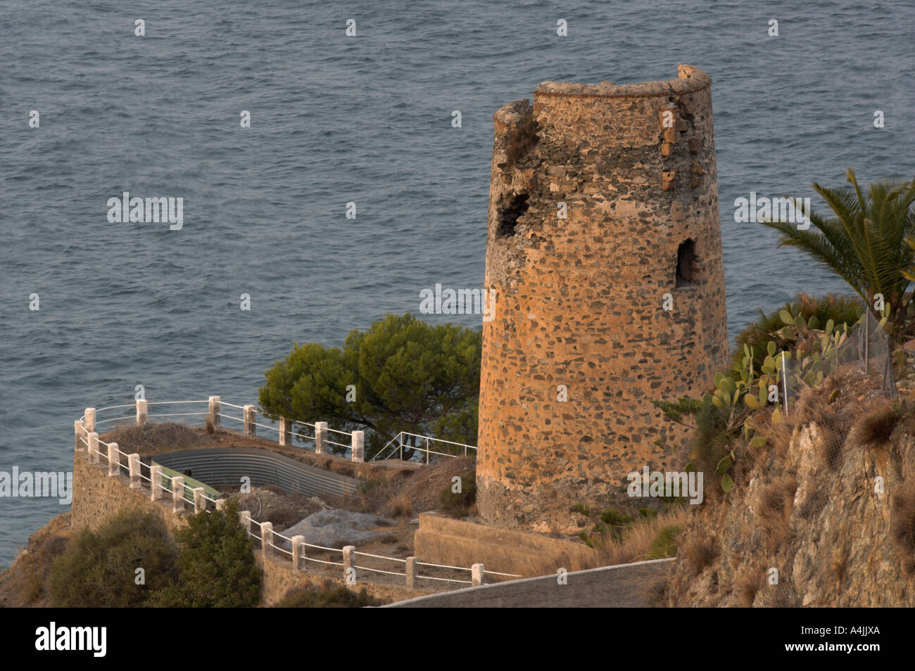 Middle age watchtower in the seashore for Mauresque attacks surveillance Nerja Málaga Spain Stock Photo