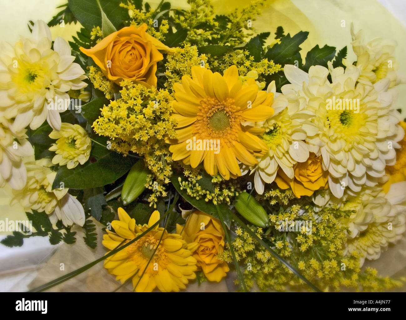 Yellow mixed bouquet in cellophane wrap Stock Photo