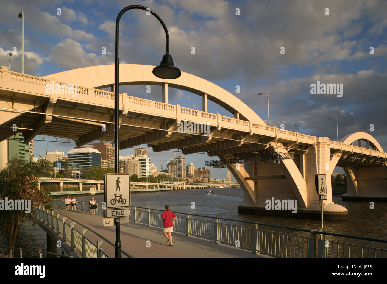 Joggers and walkers on the River Walk along the Brisbane River. Stock Photo