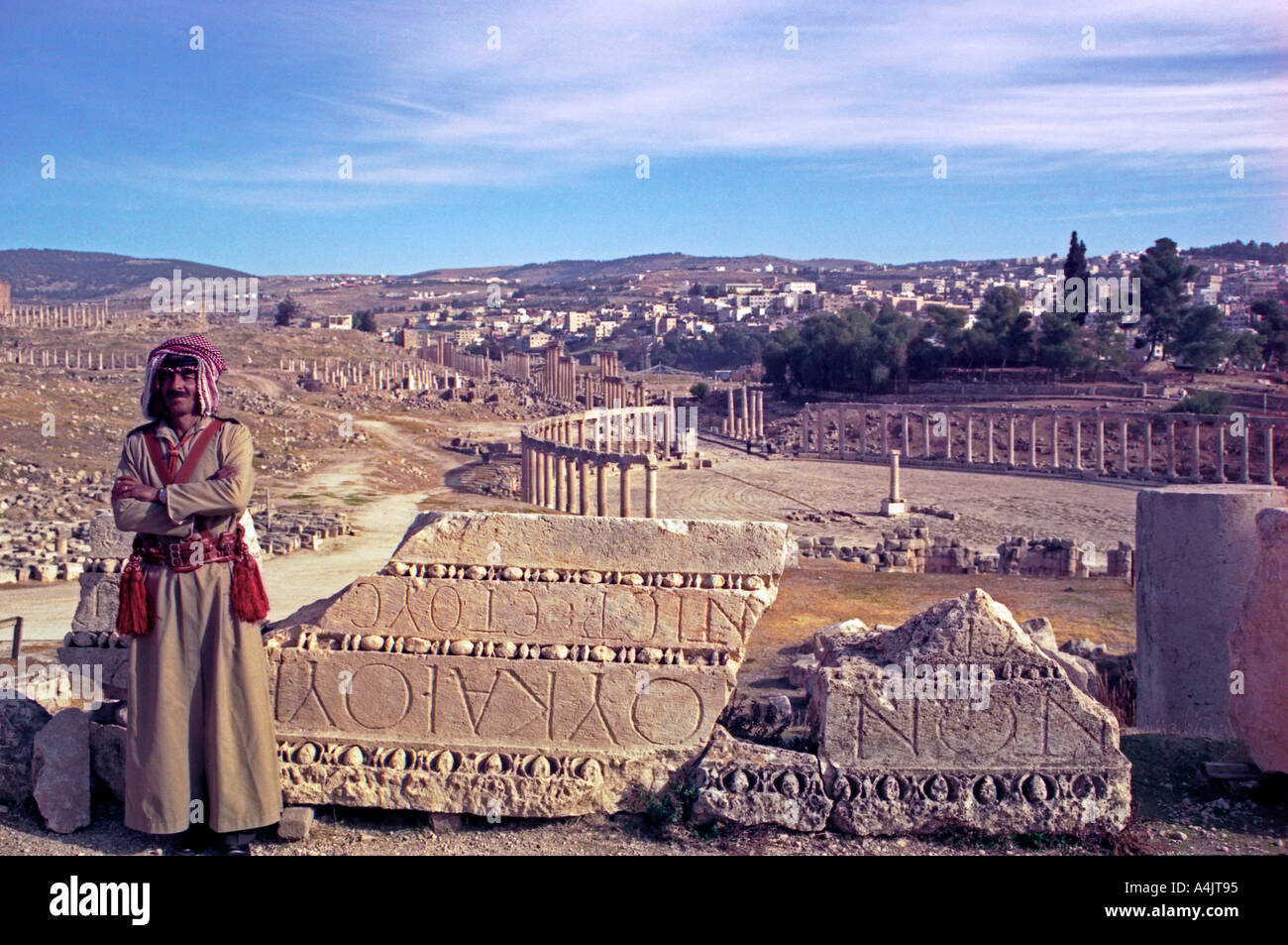 Jordan The Middle East Policeman on duty at Jerash Ancient Gerasa with the Oval Forum in the background Stock Photo