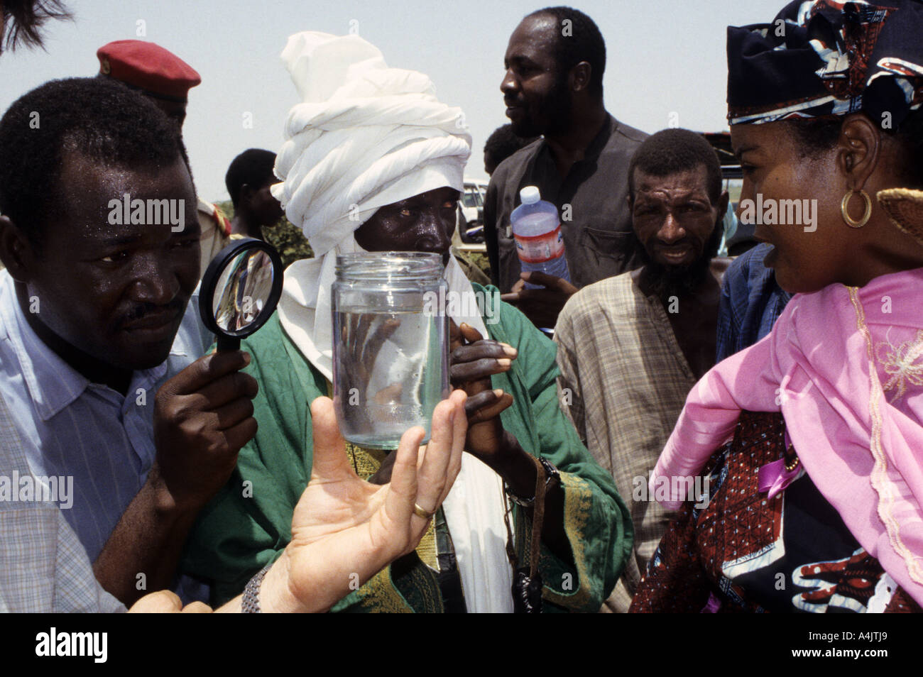 Health Official Examines Water for Guinea Worm, Niger. Stock Photo