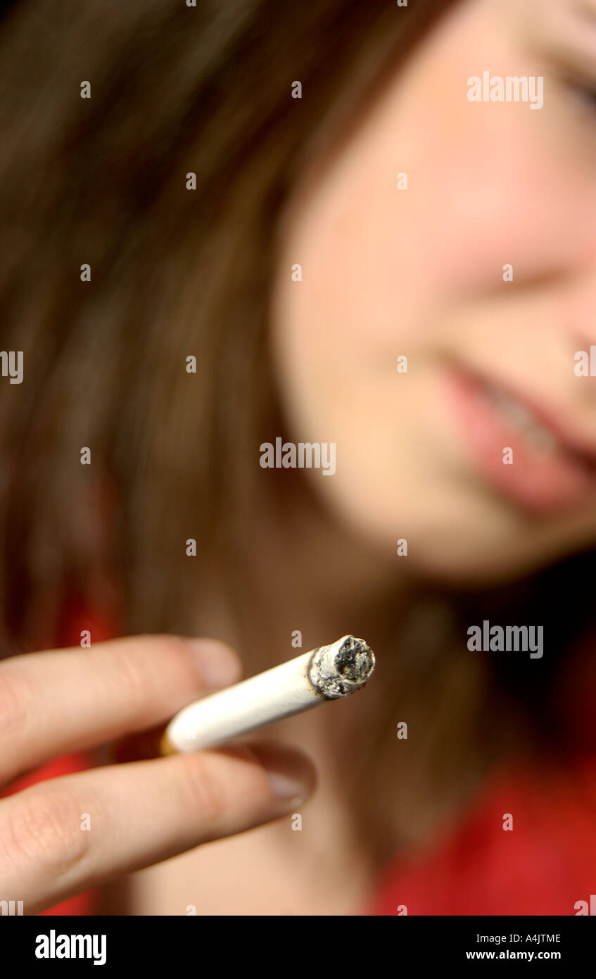 Teenage girl smoking a cigarette Stock Photo