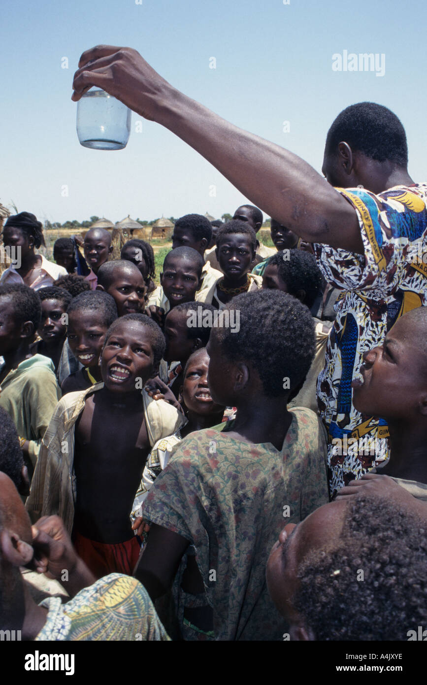 Guinea Worm Education and Eradication, Niger. Doctor showing copepods in water. Stock Photo