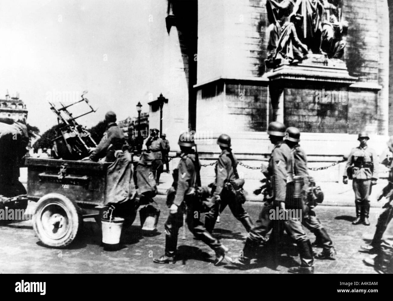 German troops marching past the Arc de Triomphe, Paris, June 1940. Artist: Unknown Stock Photo