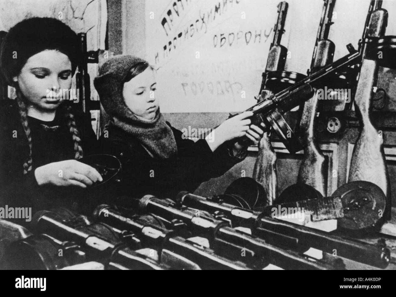 Young girls assembling machine guns in a Russian factory, 1943. Artist: Unknown Stock Photo