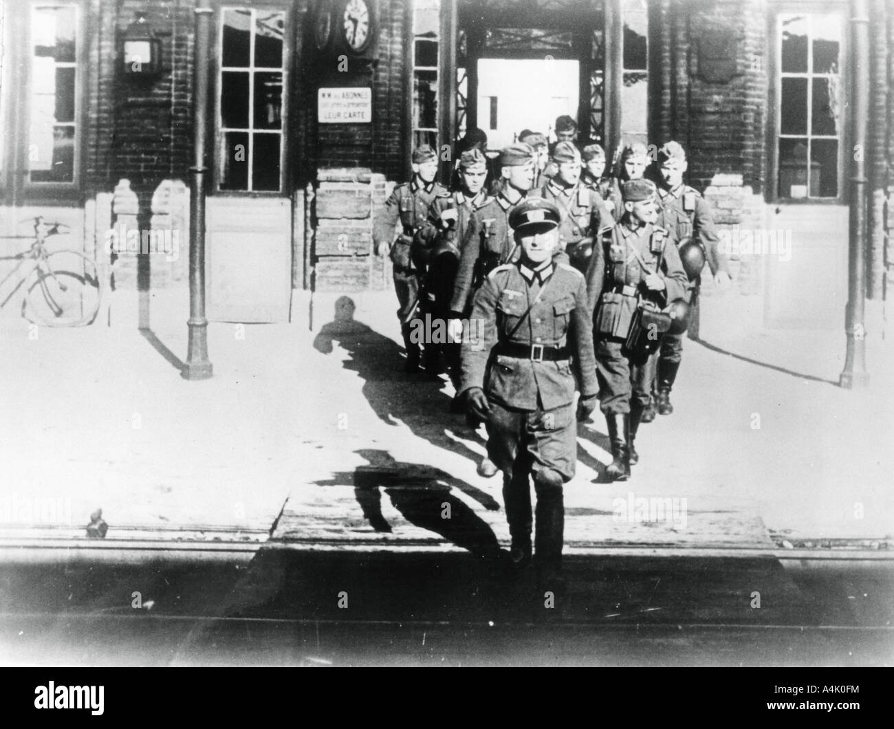 German army officer leading his company onto a railway station platform, Paris, August 1940. Artist: Unknown Stock Photo