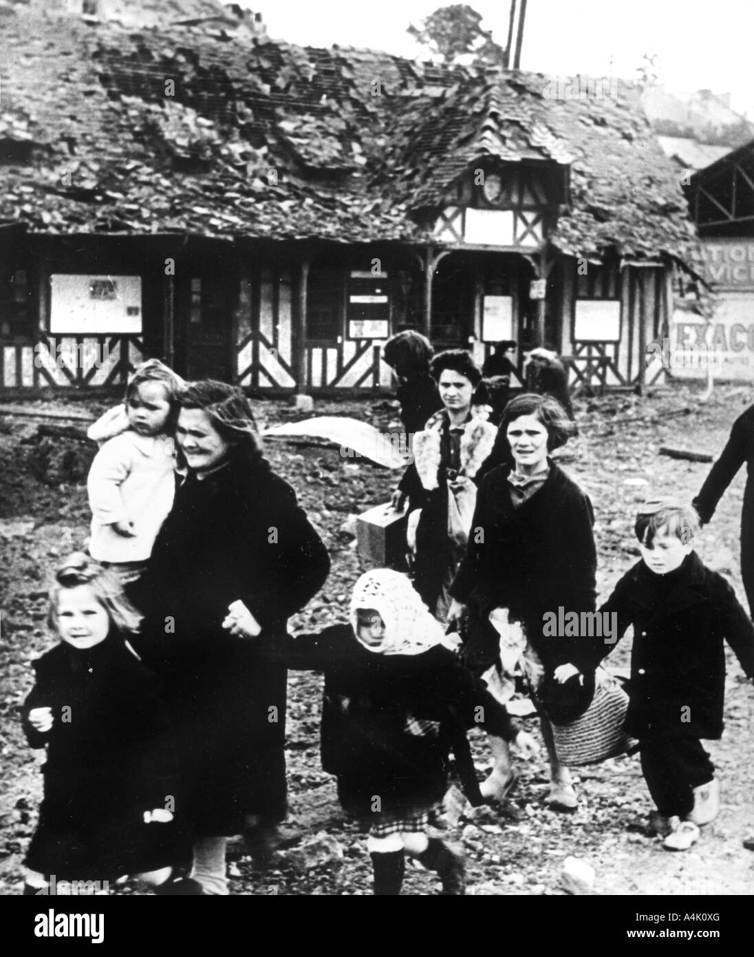 Families leaving their village bombarded during the Normandy landings, France, 1944. Artist: Unknown Stock Photo